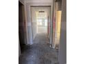 Long hallway featuring smooth walls, designer ceiling accents and light leading to an open living space at 1245 Crested Iris Way, North Myrtle Beach, SC 29582