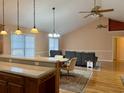 Kitchen with island, hardwood floors, and vaulted ceiling at 201 Melody Gardens Dr., Surfside Beach, SC 29575