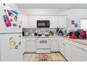 White kitchen with appliances and ample counter space at 248 Sun Colony Blvd. # A-305, Longs, SC 29568