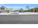 Tan house with white garage door, snow on the ground at 281 Columbus St., Conway, SC 29526