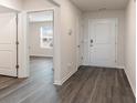 Bright entryway with dark gray vinyl plank flooring at 3430 Ashridge Way, Conway, SC 29526