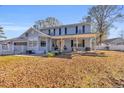 Two-story house with covered porch and landscaped yard at 404 Cedar Run Dr., Myrtle Beach, SC 29588