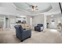 Open concept living space with pale walls and a view into the kitchen at 409 Carrick Loop, Longs, SC 29568