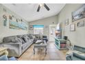 Cozy living room features tile floors, vaulted ceilings, and ample natural light at 412 Chesterfield Ct., Myrtle Beach, SC 29577