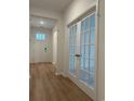 Inviting entryway featuring wood-look floors, modern doors, and natural light, creating a warm and welcoming space at 45 Northbrook Dr, Murrells Inlet, SC 29576