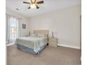 Bedroom featuring neutral walls, a queen bed, and a window for natural light at 4846 Carnation Circle # 203, Myrtle Beach, SC 29577