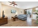 Bright living room features hardwood floors, comfy seating, and a view into the dining area at 4919 Cinzia Ln. # 6-B, North Myrtle Beach, SC 29582