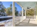 Spacious front porch with white columns and light blue ceiling at 55 Pineberry Dr., Georgetown, SC 29440