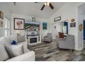 Bright living room with vaulted ceiling, hardwood floors, and comfy seating at 608 Surfsong Way # 608, North Myrtle Beach, SC 29582