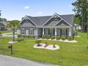 Elevated view of a lovely single-story home featuring a beautifully landscaped front yard at 901 Queensferry Ct., Conway, SC 29526