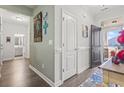 Hallway with light walls, wood floors and doors to other rooms at 901 Queensferry Ct., Conway, SC 29526