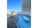 Relaxing lazy river pool with lounge chairs nearby at 9550 Shore Dr. # 1132, Myrtle Beach, SC 29572