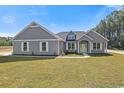 Gray siding home with a green door and white shutters at Tbd Hodges Rd., Conway, SC 29527