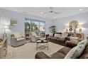 Spacious living room featuring brown leather sofas and a neutral color scheme at 117 A N Dogwood Dr., Surfside Beach, SC 29575