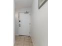 A white entry door with security features in a hallway setting at 2504 North Ocean Blvd. # 436, Myrtle Beach, SC 29577
