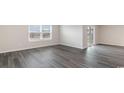 Living room with vinyl flooring and sliding glass door at 3464 Ashridge Way, Conway, SC 29526