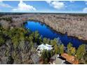 Aerial view showcasing a house's location on a waterfront lot at 462 Mohican Dr., Georgetown, SC 29440