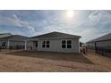 A fenced backyard features a covered porch and an open space ready for landscaping at 6044 Fuller Ridge Ct, Conway, SC 29526