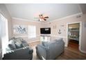 Beach-themed living room with sectional sofa and large TV at 613 Sea Mountain Hwy. # 128, North Myrtle Beach, SC 29582