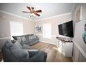 Beach-themed living room with sectional sofa and large TV at 613 Sea Mountain Hwy. # 128, North Myrtle Beach, SC 29582