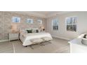 Spacious bedroom with patterned wallpaper, large windows and a comfortable bed at 1118 Barrington Way, Conway, SC 29526