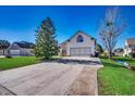 Long driveway leading to a two-car garage of a charming single Gathering home at 1579 Southwood Dr., Surfside Beach, SC 29575