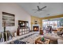 Spacious living room featuring a fireplace and vaulted ceiling at 1579 Southwood Dr., Surfside Beach, SC 29575