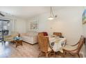 Comfortable living room with seating and access to balcony at 1891 Colony Dr. # 13D, Surfside Beach, SC 29575