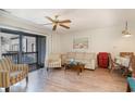Living room with balcony access and comfortable seating at 1891 Colony Dr. # 13D, Surfside Beach, SC 29575