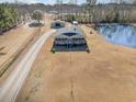 Aerial view of house with pond and detached garage at 2647 Coats Rd., Loris, SC 29569