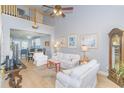 Bright living room with vaulted ceilings, hardwood floors, and white sofas at 306 River Rock Ln. # 1304, Murrells Inlet, SC 29576