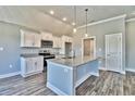 Modern kitchen with white cabinets, granite counters, and stainless steel appliances at 340 William Nobles Rd., Aynor, SC 29511