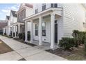 Front view of a white two-story house with a covered porch at 3525 Bristol Ln., Myrtle Beach, SC 29577