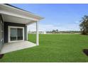 The backyard features a lawn with views of neighborhood amenities at 4319 Falls Oaks St., Myrtle Beach, SC 29579