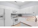 Well-equipped kitchen featuring white cabinetry and modern appliances at 4520 Lighthouse Dr. # 29-B, Little River, SC 29566