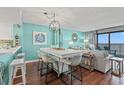Bright dining area with ocean view and teal walls at 501 S Ocean Blvd. # 505, North Myrtle Beach, SC 29582