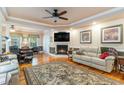 Cozy living room with a fireplace, comfortable seating, and hardwood floors at 512 Goff Creek Ct., Myrtle Beach, SC 29579