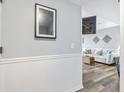 Bright entryway with modern wall paneling and view of living room at 5905 South Kings Hwy. # 216-C, Myrtle Beach, SC 29575