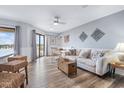 Open living room featuring hardwood floors and comfortable seating at 5905 South Kings Hwy. # 216-C, Myrtle Beach, SC 29575