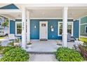Inviting front porch with white columns and seating at 5907 Haskell Circle, Myrtle Beach, SC 29572