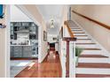 Welcoming foyer with gleaming hardwood floors and staircase leads to the home's upper level at 637 Sparrow Dr., Surfside Beach, SC 29575