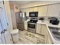 Efficient kitchen with stainless steel appliances and light cabinets at 638 Waterway Village Blvd. # 16G, Myrtle Beach, SC 29579