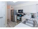 Modern kitchen boasting stainless steel appliances and light-colored cabinets at 638 Waterway Village Blvd. # 16G, Myrtle Beach, SC 29579