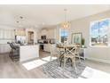 Open kitchen with white cabinets, granite countertops, stainless steel appliances, and an island at 7027 Shooting Star Way, Myrtle Beach, SC 29579