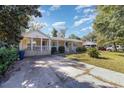 House exterior featuring a front porch and driveway at 709 63Rd Ave. N, Myrtle Beach, SC 29572