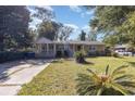 Tan house with front porch and large yard at 709 63Rd Ave. N, Myrtle Beach, SC 29572