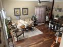 Spacious living area with hardwood floors, fireplace, and natural light at 804 Brenda Pl., Myrtle Beach, SC 29577