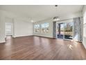 Bright living room with hardwood floors and access to a back patio at 1004 Bonnet Dr., North Myrtle Beach, SC 29582