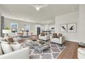 Spacious living room with hardwood floors, comfy seating, and open concept design at 1004 Bonnet Dr., North Myrtle Beach, SC 29582