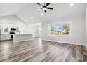 Open living space with hardwood floors, high ceilings and a view to the kitchen at 1113 Crooked Hook Rd., North Myrtle Beach, SC 29582